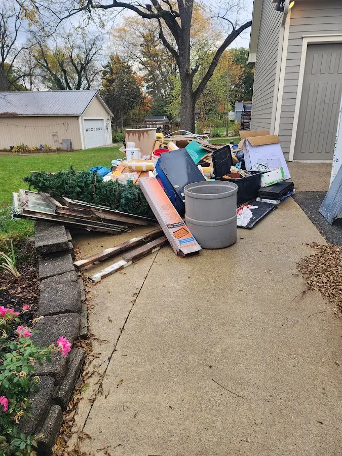 Dumpster being loaded with debris for Commercial Dumpster Rental in Rockton
